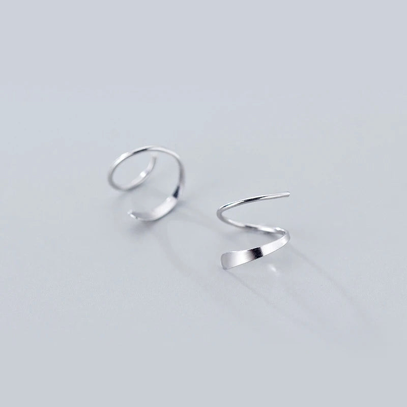 Silver earrings in geometric wave shape for everyday wear